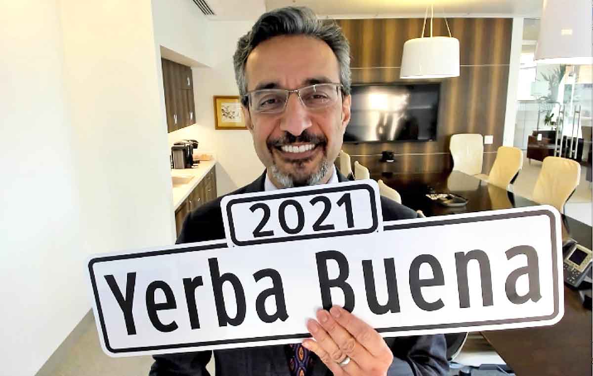Dean Nadershahi holding a sign that says 2021 Yerba Buena