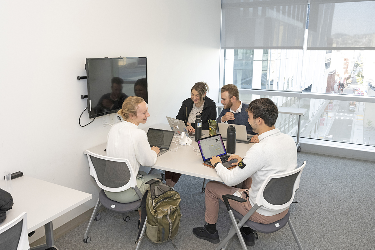 students around a conference table