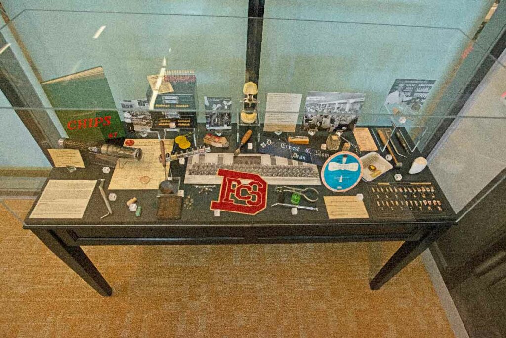 The P&S Years display case in the foyer of Dorfman Hall